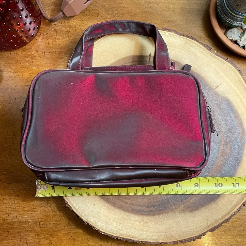 Deep burgundy iridescent handbag make up bag roomy storage opens wide zipper